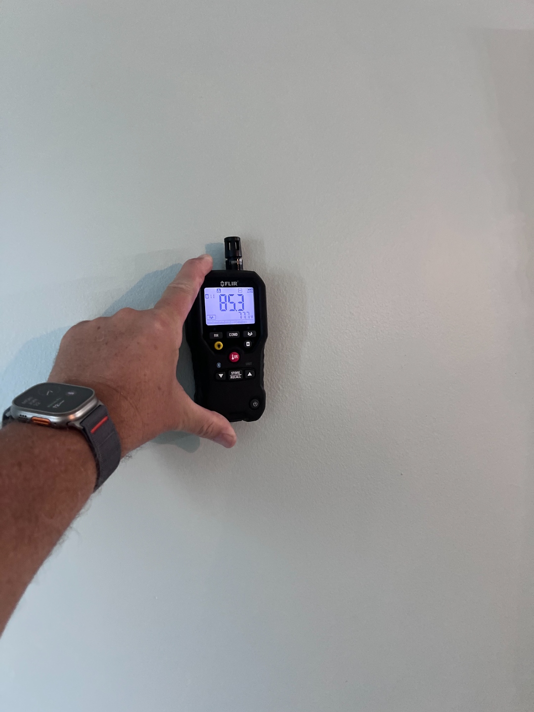 FLIR moisture meter reading taken directly on an interior wall surface
