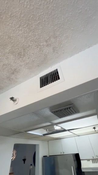 Kitchen ceiling and vent area inspected for moisture and airflow issues